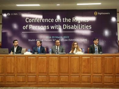 participants sitting on the stage for a session